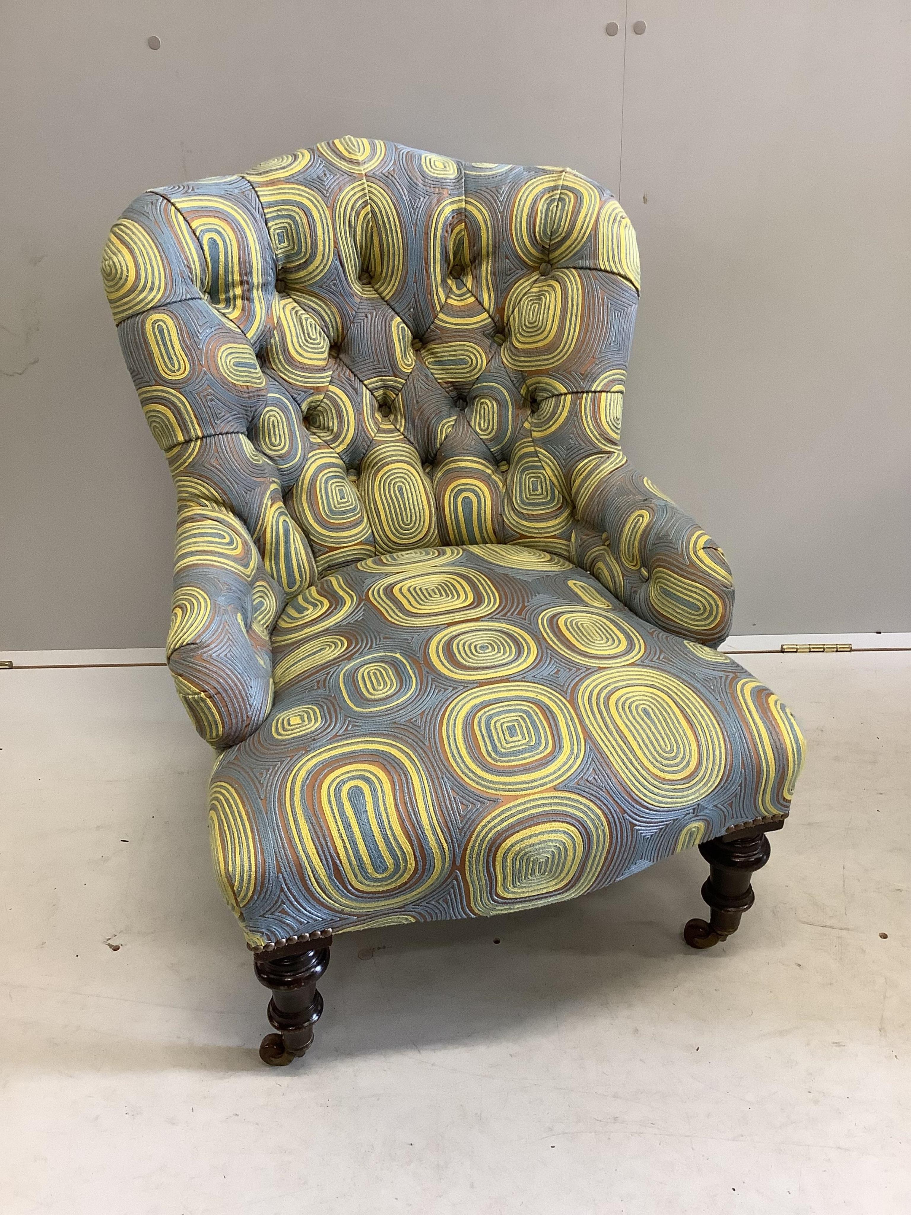 A late Victorian nursing chair, recently re-upholstered in a contemporary retro-style fabric, width 63cm, depth 63cm, height 76cm